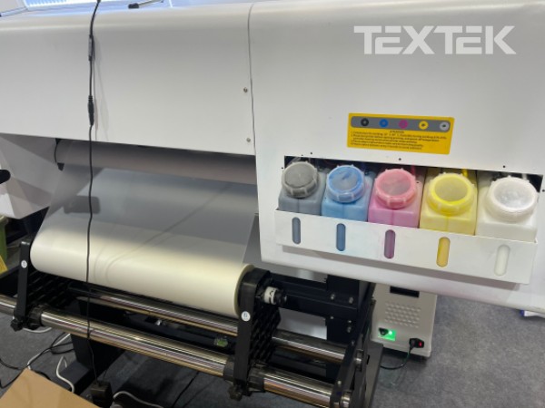 What kind of printing equipment is used for clothing printing? Direct to PET film printer